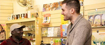 Male volunteers in acharity shop